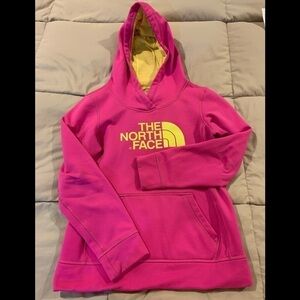 The North Face Womens hot pink hoodie with yellow lettering. Pullover. Size S/P.